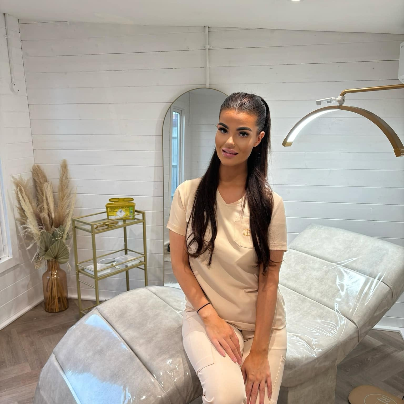 Amber seated in her private aesthetics clinic in Oakley
